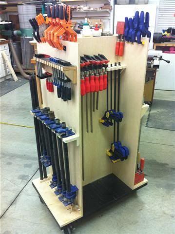 It holds about 50 clamps, takes up a little more than four square feet of floor space and can honestly be built in an afternoon. Pin on DIY Workshop Projects
