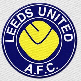 The new badge is mainly blue and has a rhino with the word rhino above it in a semi circle and leeds at the top of the badge. Leeds United will reconsider design of new badge | Daily ...