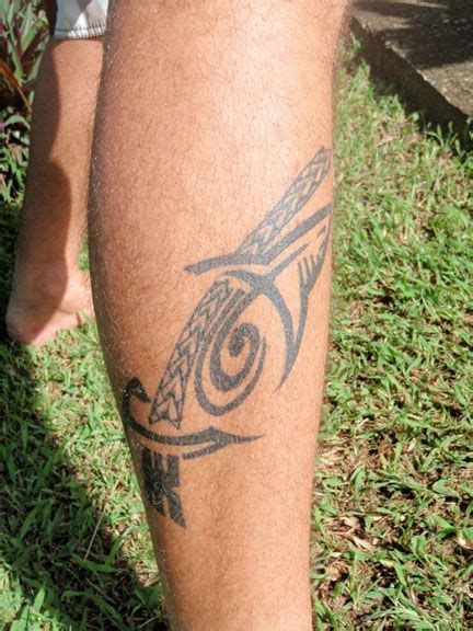 A Close Up Of A Person With Tattoos On Their Legs