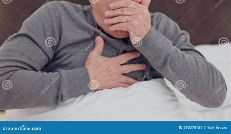 Senior Man Coughing With Chest Infection Allergies Or Sickness In Bed