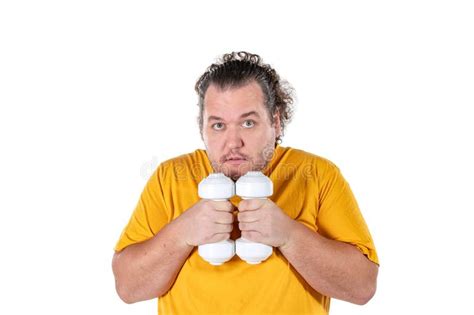 Funny Fat Man Exercising With Dumbbells And Looking At Camera Isolated