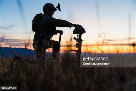 Soldier Kneeling At Grave Photos And Premium High Res Pictures Getty