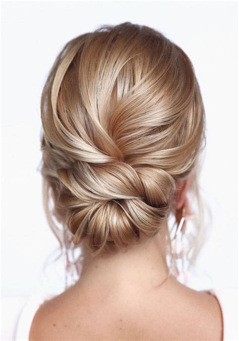 20 Trendy Low Bun Wedding Updos And Hairstyles 2023