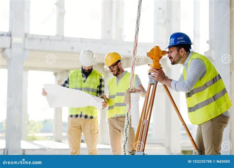Portrait Of Construction Engineers Working On Building Site Stock Photo