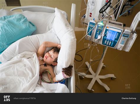 Young Boy Sleeping In Hospital Bed Stock Photo Offset