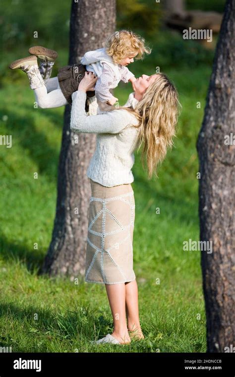 Mother Daughter Lifting Mom Mothers Mum Daughters Stock Photo Alamy