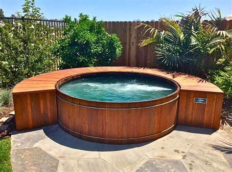 What type of cleaning is involved with hot tubs? Redwood hot tub built by www.gordonandgrant.com | Custom ...