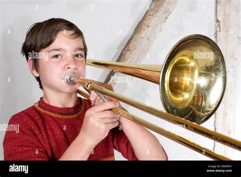 Portrait Of A Boy Playing The Trombone Stock Photo Alamy