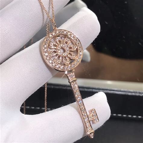 A bold, graduated chain of gauge links captures the urban edge of the city, making a stunning statement. Tiffany & Co. Petal Key Pendant Necklace 18k Rose Gold with Pave Diamonds, Large Size