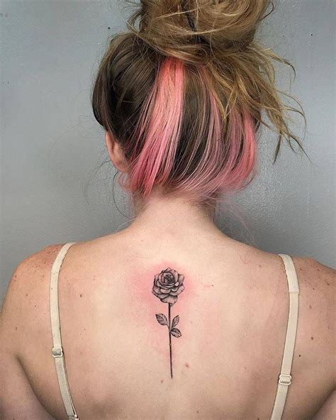This rose tattoo features a single rose in full bloom, complete with stem and leaves. Single needle rose tattoo on the upper back. | Upper back ...