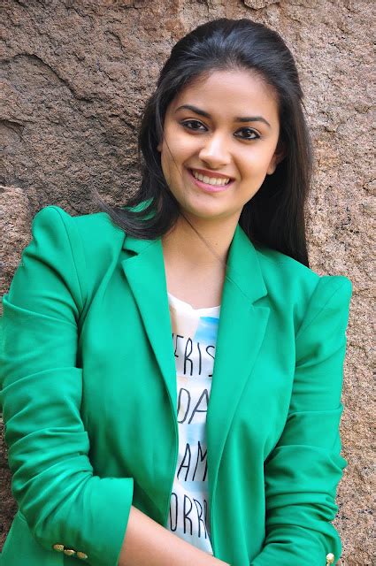 Keerthy Suresh Cool Glam Look In Tight Jeans Posing In The Park Bench