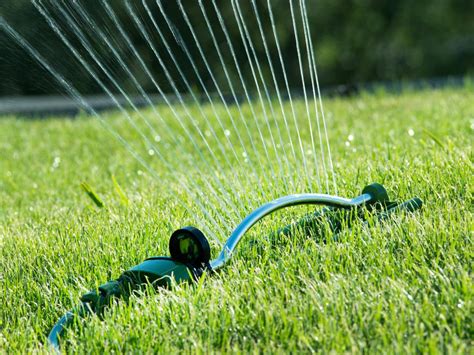 Use a spray gun attachment with a light mist, this will mimic rainfall and prevent displacing any seeds or grass. How often do you water your #Lawn? - Pure Green Lawn Care Lansing Michigan