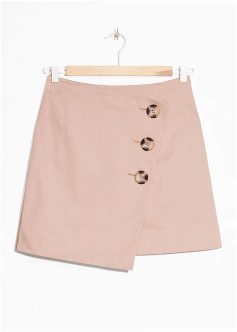 Asymmetric Button Mini Skirt Light Pink Mini Skirts And Other