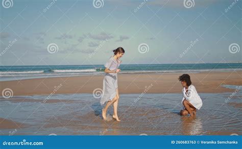 Lesbian Couple Having Fun At Ocean Beach Cheerful Girls Playing Splashing Water Stock Video
