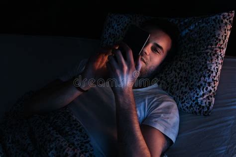Man Using Smartphone In Bed At Night Stock Image Image Of Adult