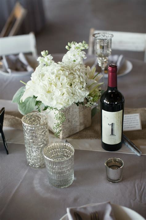 If you want to add a touch of whimsy to your living room, get inspired by table made of wooden boards. Wine Bottle Table Number