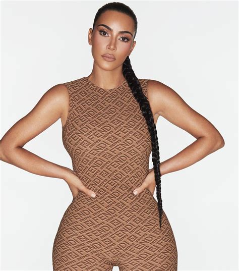 kim kardashian busts out of see through bra and skintight bodysuit as she models fendi and skims