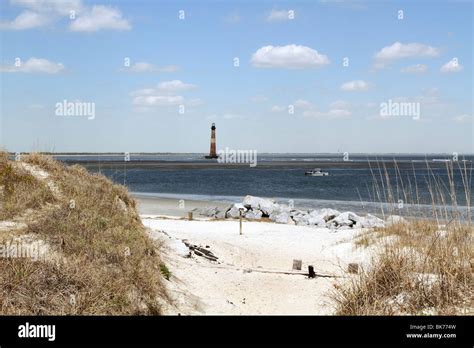 Folly Island Beach With Lighthouse In The Distance Charleston Sc Usa