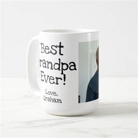 A White Coffee Mug With The Words Best Grandpa Ever And An Image Of A Man