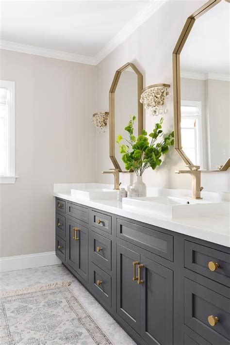 We did not find results for: Glass droplets sconces flank a gold mirror over a black ...
