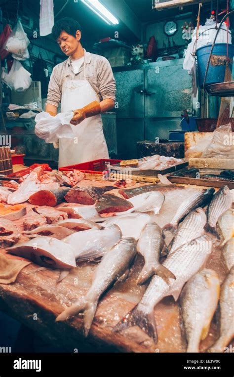 Asian Fishmonger Or Fish Seller In Hong Kong Wet Market Stock Photo Alamy