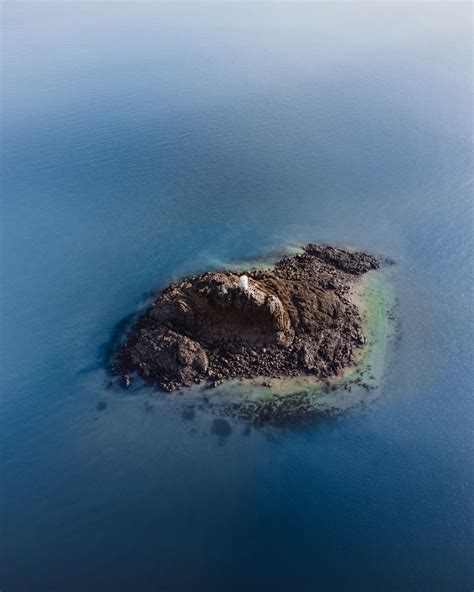 Aerial View Of Island In The Middle Of Blue Sea Photo Free Image On