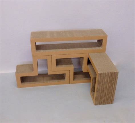 This is a home decorating idea for c. Cardboard Puzzle Piece Modular Shelf or Coffee Table ...