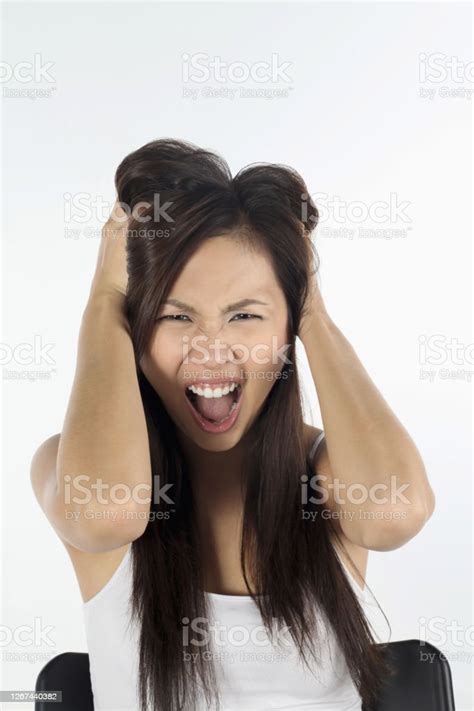Woman Pulling Hair And Screaming Stock Photo Download Image Now