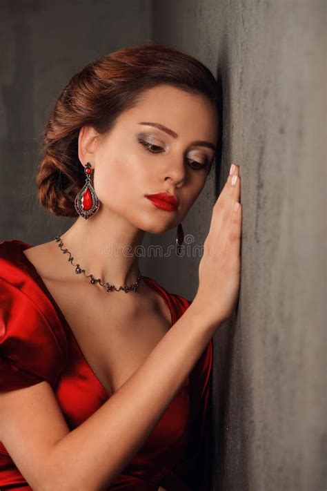 Beautiful Woman In Red Dress With Professional Make Up Stock Image