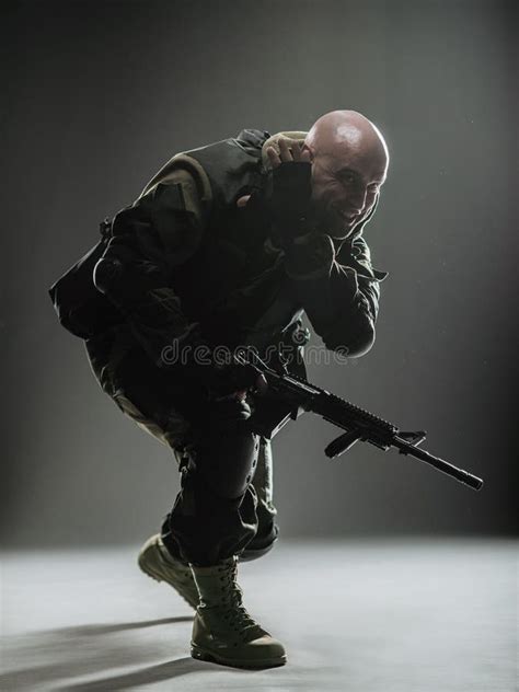Special Forces Soldier Man With Machine Gun On A Dark Background Stock