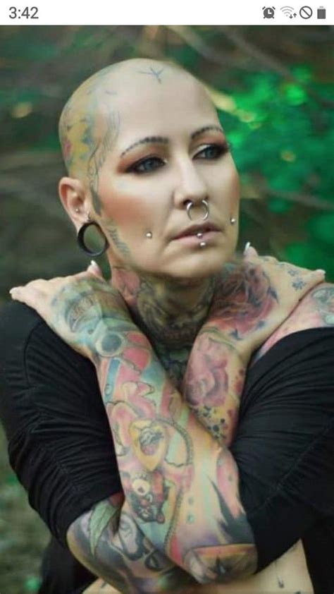 Tattooed And Pierced Bald Head Women In