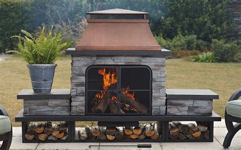 A Wood Burning Outdoor Fireplace Placed On A Concrete Patio Outdoor