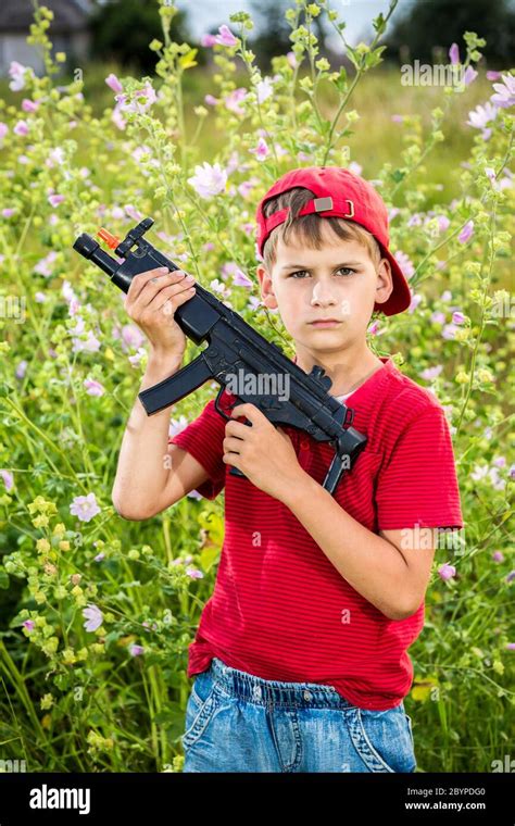 Holding Gun Child Hi Res Stock Photography And Images Alamy
