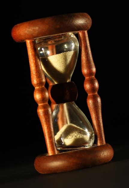 Close Up Vintage Hourglass With Black Background Photo Free Download