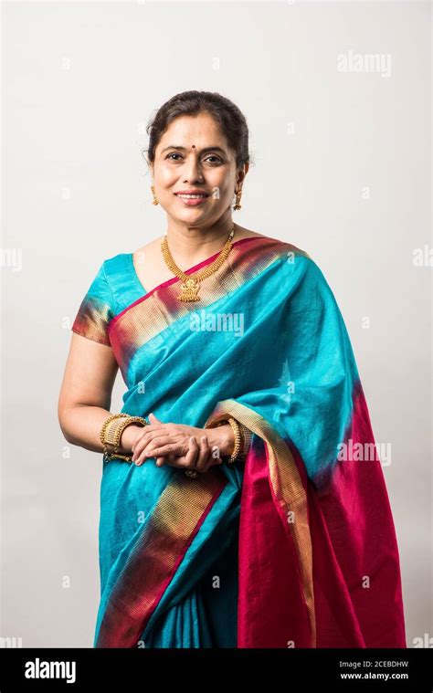 Portrait Of Happy Old Indian Woman Or Lady In Ethnic Saree With Jewelry Or Jewellery Isolated