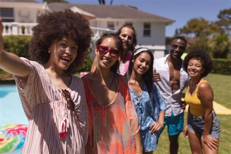 Premium Photo Portrait Of Diverse Group Of Friends Taking Selfie At A Pool Party Hanging Out