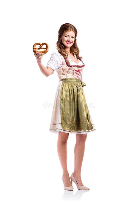 Beautiful Woman In Traditional Bavarian Dress Holding A Pretzel Stock
