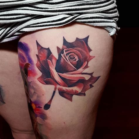 A black and gray maple leaf, rendered on the wearer's upper arm, is featured in this tattoo. Maple Leaf-Shaped Rose Tattoo | Best Tattoo Ideas Gallery