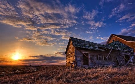 Amazing Sunset Sky Above The Forgotten House On The Field Wallpaper