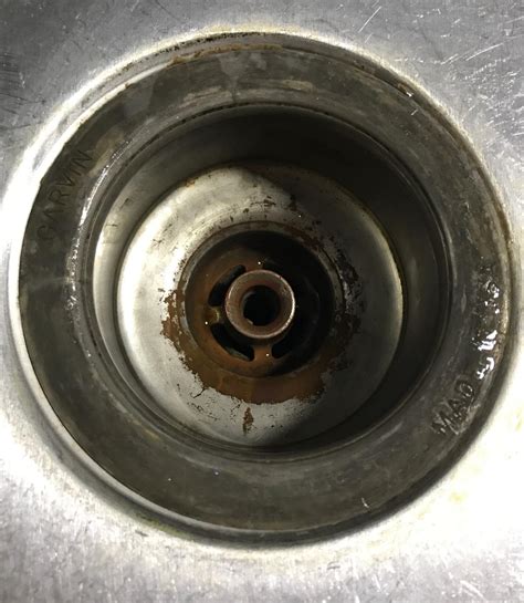 If your kitchen sink is leaking and its not from the drain pipe below, it may be leaking from where the sink basin and the drain connect. leak - What is this dark oily liquid leaking from the ...
