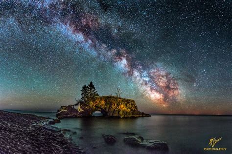 The Milky Way Arching Over The Sea Stack Of Hollow Rock Off The Coast