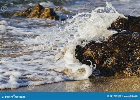 Soft Wave Hitting Sandy Beach Under Bright Sunny Day Stock Photo