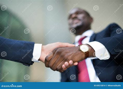 African Businessman Shaking Hands With A Caucasian One Stock Photo