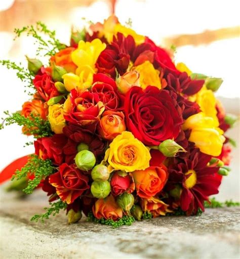 Wedding Bouquet Arranged With Red Yellow Orange Roses And Spray Roses