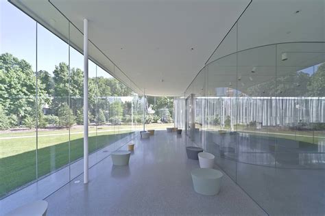 Nearly Invisible Sanaas Minimalistic Curved Glass Façades