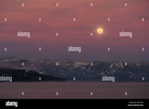 Full Moon Rising Over Lake Tahoe In Winter Stock Photo Alamy