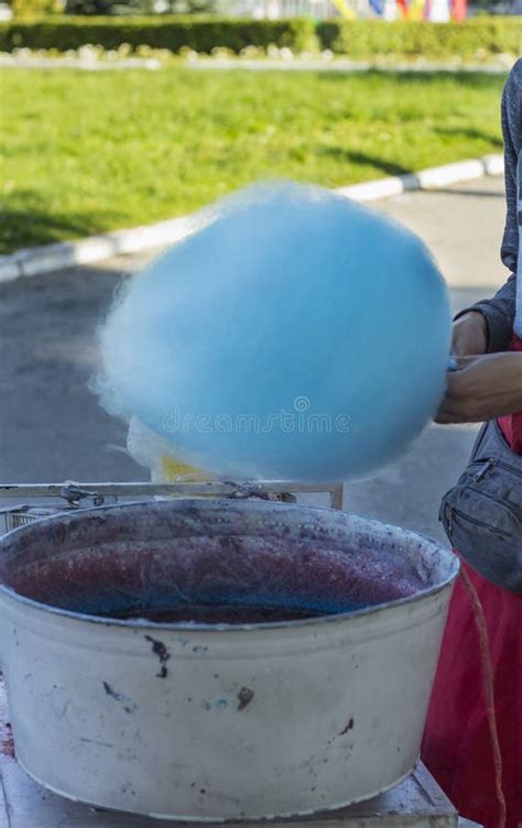 The Process Of Preparing Cotton Candy Seller In The Park In A Special