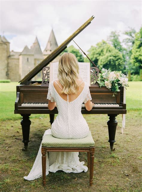 Bride Playing Grand Piano In The Gardens Of Chateau De Bonneval France