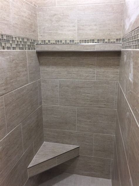 A demonstration of the running bond pattern of tile in a tub/shower, a pattern which is used for subway tile and similar styles. master bath shower in 12x24 porcelain tile installed at a ...