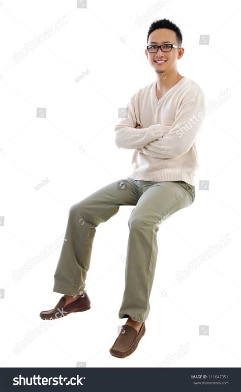 Full Body Asian Man Sitting On A Transparent Block Over White